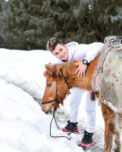 viplove master with a horse in snow